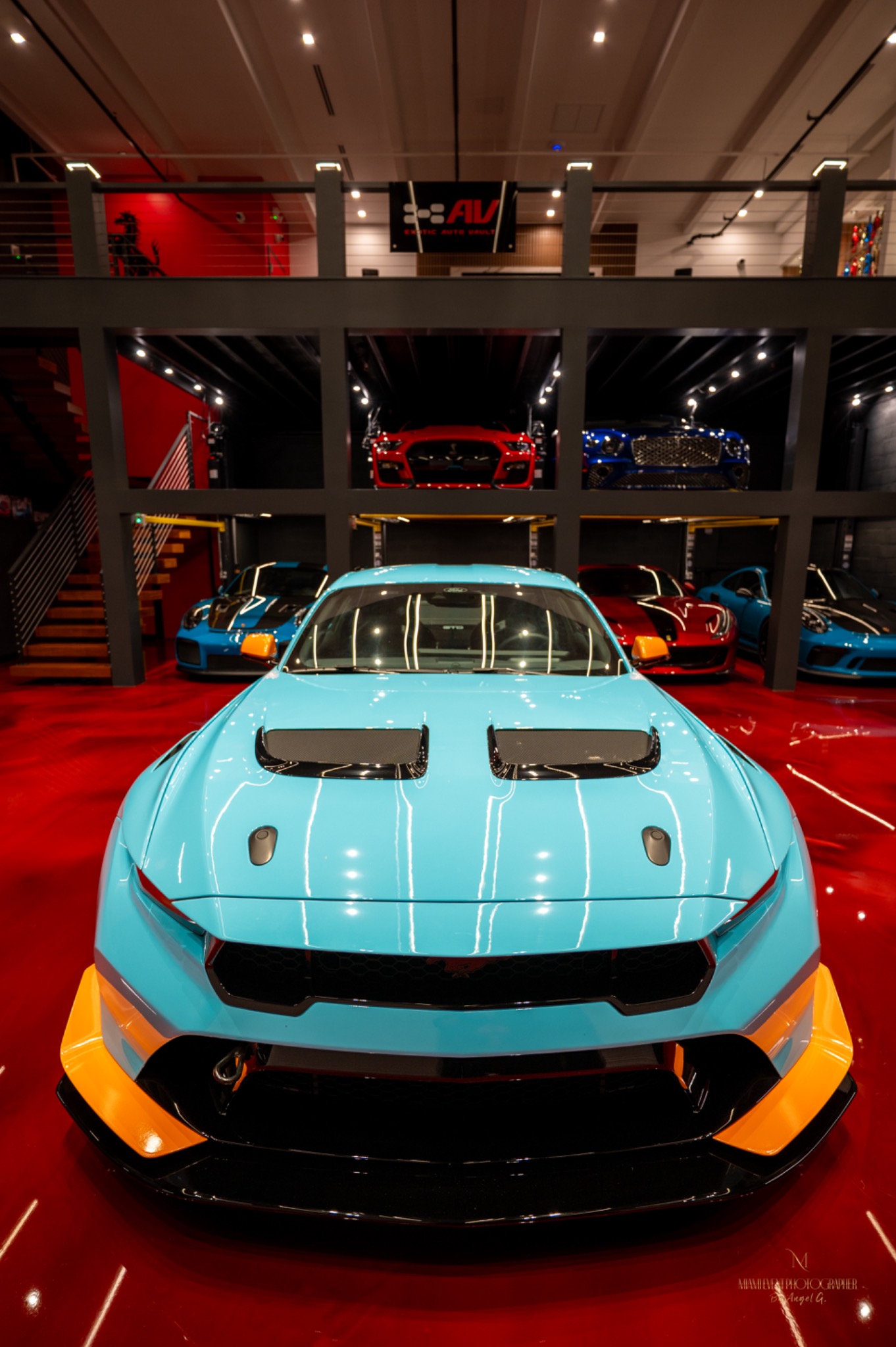 Bright performance car photographed inside a showroom
