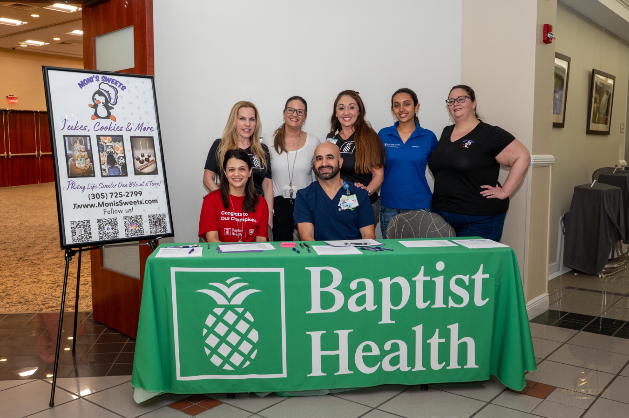 Community representatives gathered at an event table