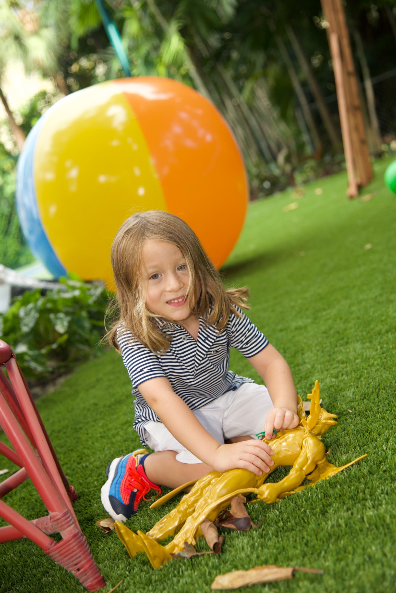 Child playing outside during a family gathering